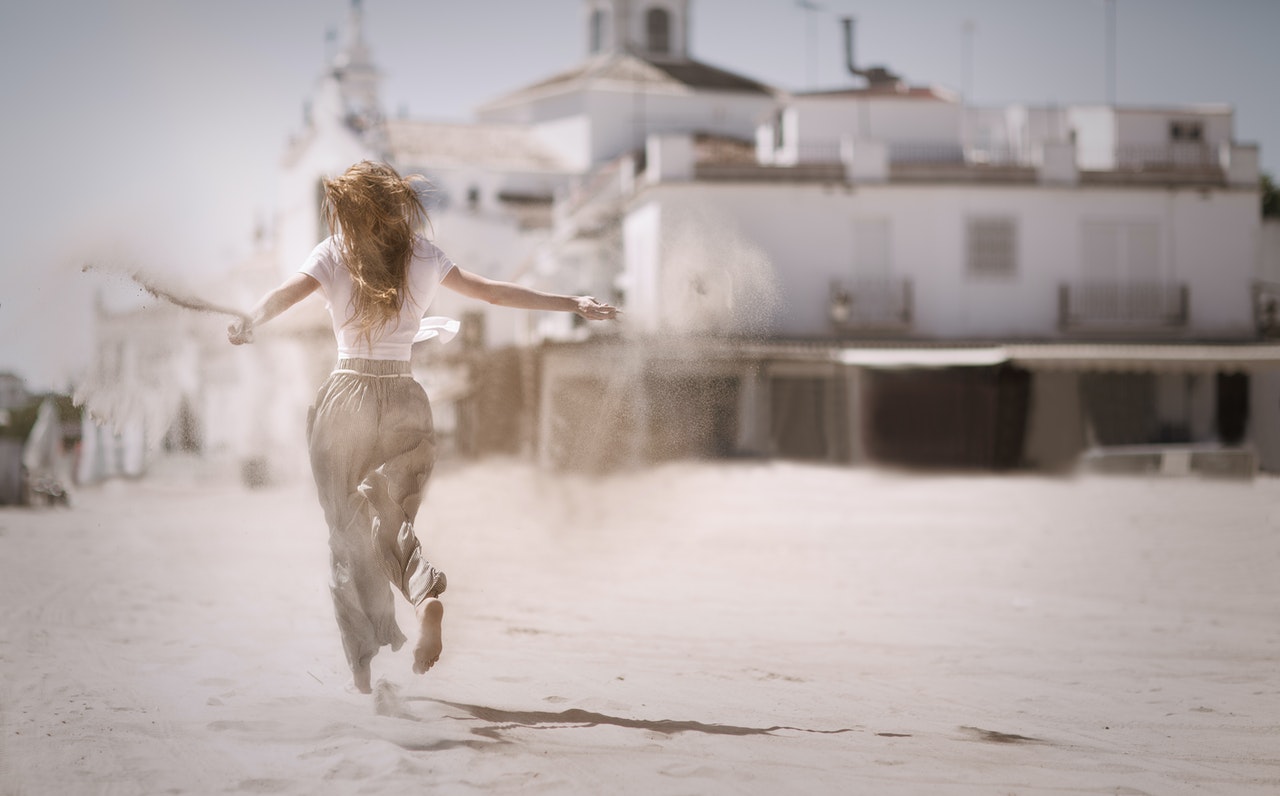 Woman Running on the Beach